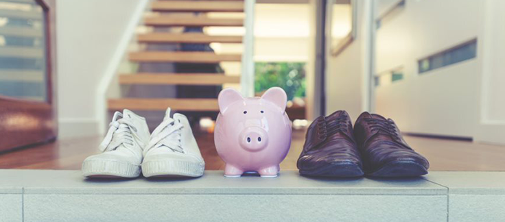 home loan savings in piggy bank next to shoes