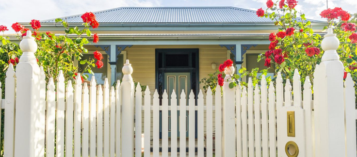 home with white picket fence