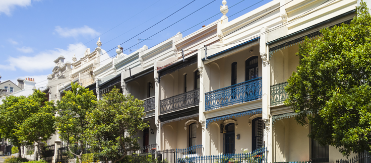 shot of white townhouses on a sunny day